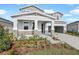 Two-story home with stone accents and a two-car garage at 1413 August Gray Dr, Kissimmee, FL 34744