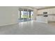 Open concept kitchen with island and sliding glass doors to backyard at 1413 August Gray Dr, Kissimmee, FL 34744