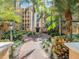 Landscaped courtyard entrance to the building at 12544 Floridays Resort Dr # 202B, Orlando, FL 32821