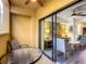 Private balcony with glass-top table and chairs, perfect for relaxing outdoors at 12544 Floridays Resort Dr # 202B, Orlando, FL 32821