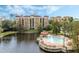 Luxury condo community with a resort-style pool and serene lake views at 12544 Floridays Resort Dr # 202B, Orlando, FL 32821
