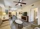 Open living area with hardwood floors, comfy seating, and views into dining and kitchen areas at 12544 Floridays Resort Dr # 202B, Orlando, FL 32821