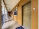 Residential hallway with doors to individual units at 12538 Floridays Resort Dr # C-211, Orlando, FL 32821