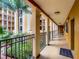 Inner hallway with lush courtyard views at 12538 Floridays Resort Dr # C-211, Orlando, FL 32821