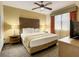 Bedroom with king-size bed, nightstands, and a TV at 12538 Floridays Resort Dr # C-211, Orlando, FL 32821