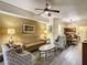 Open-concept living room and dining area at 12538 Floridays Resort Dr # C-211, Orlando, FL 32821