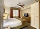 Main bedroom with king-size bed, TV and dresser at 12538 Floridays Resort Dr # C-211, Orlando, FL 32821