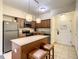 Kitchen with island, stainless steel appliances at 12538 Floridays Resort Dr # C-211, Orlando, FL 32821