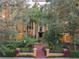 Building entrance with landscaping and walkways at 12538 Floridays Resort Dr # C-211, Orlando, FL 32821