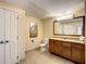 Bathroom with toilet, vanity, and a mirror at 12538 Floridays Resort Dr # C-211, Orlando, FL 32821