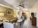 Open living room with kitchen and dining area at 12538 Floridays Resort Dr # C-211, Orlando, FL 32821