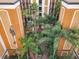 Building courtyard with lush tropical landscaping and walkways at 12538 Floridays Resort Dr # C-211, Orlando, FL 32821
