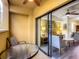 Balcony with seating and glass doors leading to living room at 12538 Floridays Resort Dr # C-211, Orlando, FL 32821