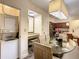 Dining area with table and chairs, kitchen in background at 12538 Floridays Resort Dr # C-211, Orlando, FL 32821