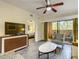 Relaxing living room with flat-screen TV and access to balcony at 12538 Floridays Resort Dr # C-211, Orlando, FL 32821
