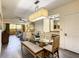 Open dining area with a glass table and modern chairs at 12538 Floridays Resort Dr # C-211, Orlando, FL 32821