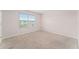 Well-lit bedroom with neutral walls and carpeting at 1885 Hickory Blf, Kissimmee, FL 34744