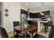 Modern kitchen with breakfast bar and casual dining area at 5012 E Fountainwood Dr, St Cloud, FL 34772