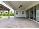 Relaxing covered patio with ceiling fan and pavers at 5012 E Fountainwood Dr, St Cloud, FL 34772