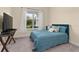 Cozy bedroom with a double bed, TV, and window at 5012 E Fountainwood Dr, St Cloud, FL 34772