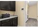 Laundry room with washer, dryer, and built-in cabinets at 5012 E Fountainwood Dr, St Cloud, FL 34772