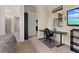 Comfortable bedroom with a workspace, built in shelving, and access to an ensuite bathroom at 5012 E Fountainwood Dr, St Cloud, FL 34772