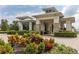 Community gated entrance with stone and landscaping at 5012 E Fountainwood Dr, St Cloud, FL 34772
