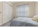 Simple bedroom with a twin bed and closet at 5012 E Fountainwood Dr, St Cloud, FL 34772