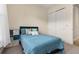 Well-lit bedroom featuring a double bed and closet at 5012 E Fountainwood Dr, St Cloud, FL 34772