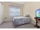Small bedroom with a twin bed and window at 5012 E Fountainwood Dr, St Cloud, FL 34772
