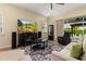 Living room with comfortable seating, large TV, and sliding glass doors at 5012 E Fountainwood Dr, St Cloud, FL 34772