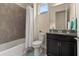 Clean bathroom with tub, shower, and granite vanity at 5012 E Fountainwood Dr, St Cloud, FL 34772
