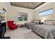 Guest bedroom with two beds, a red accent chair, and large window at 5012 E Fountainwood Dr, St Cloud, FL 34772