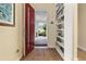Bright entryway with red door and built-in shelving at 5012 E Fountainwood Dr, St Cloud, FL 34772