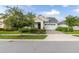 Craftsman style home with two-car garage and well-maintained lawn at 5012 E Fountainwood Dr, St Cloud, FL 34772