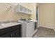 Bright laundry room with washer, dryer and shelving at 5012 E Fountainwood Dr, St Cloud, FL 34772