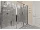 Spacious walk-in shower with glass enclosure and gray tile surround at 5012 E Fountainwood Dr, Saint Cloud, FL 34772