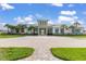 Community clubhouse with paver driveway and landscaping at 5012 E Fountainwood Dr, St Cloud, FL 34772