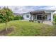 Landscaped backyard with pergola and paver patio at 5012 E Fountainwood Dr, St Cloud, FL 34772