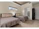 Spacious bedroom with two twin beds, ensuite bathroom access, and ample natural light at 5012 E Fountainwood Dr, St Cloud, FL 34772