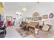 Bright living room features a comfortable sofa and chairs, creating a welcoming atmosphere at 220 Lewis Dr, Davenport, FL 33837
