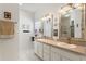 Double vanity bathroom with a large mirror and tiled floor at 220 Lewis Dr, Davenport, FL 33837