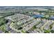 Aerial view showing the property's location within a residential neighborhood near a lake at 220 Lewis Dr, Davenport, FL 33837