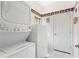 Laundry room with washer, dryer, and extra storage at 220 Lewis Dr, Davenport, FL 33837
