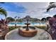 Ornate fountain in the center of a community pool at 220 Lewis Dr, Davenport, FL 33837