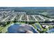 Aerial view showing home location in a community with lake access and surrounding landscape at 220 Lewis Dr, Davenport, FL 33837