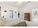 Main bedroom with a dresser and access to the backyard at 220 Lewis Dr, Davenport, FL 33837