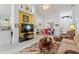 Spacious living room with a large TV and comfortable seating at 220 Lewis Dr, Davenport, FL 33837