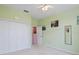 Well-lit bedroom with ample closet space and neutral wall colors at 220 Lewis Dr, Davenport, FL 33837