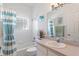 Clean bathroom with shower/tub combo and updated vanity at 220 Lewis Dr, Davenport, FL 33837